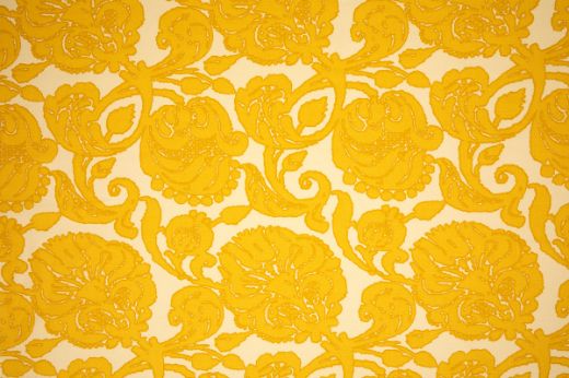 Anna floral linen fabric in yellow hues with a repetitive floral pattern, designed by Michael Szell for Christopher Farr Cloth.