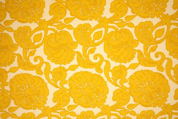 Anna floral linen fabric in yellow hues with a repetitive floral pattern, designed by Michael Szell for Christopher Farr Cloth.