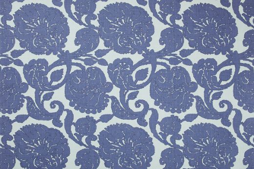 Anna floral linen fabric in blue hues with a repetitive floral pattern, designed by Michael Szell for Christopher Farr Cloth.