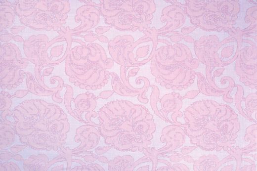 Anna floral linen fabric in lilac hues with a repetitive floral pattern, designed by Michael Szell for Christopher Farr Cloth.