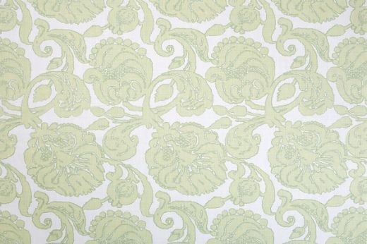 Anna floral linen fabric in shades of soft green with a repetitive floral pattern, designed by Michael Szell for Christopher Farr Cloth.