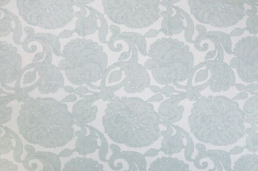 Anna floral linen fabric in pale blue tones with a repetitive floral pattern, designed by Michael Szell for Christopher Farr Cloth.