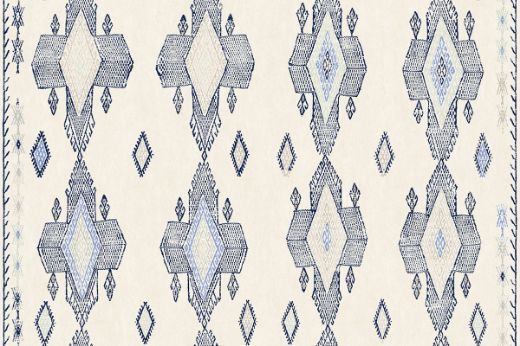 Geometric shapes in dark indigo tones with pops of blues and pale greens.