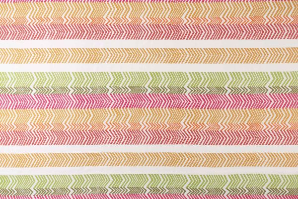 Rosa colourway Kit Kemp Bookend Perennials® Performance Woven Fabric featuring a vibrant multi-coloured striped arrow design in yellow, orange, pink, and green. 