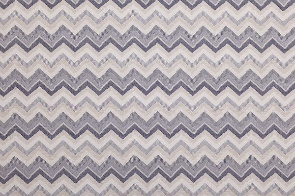 Performance Fabric in Azzurro—features tonal zigzag stripes in layered blue hues, adding a cool, modern edge to indoor and outdoor spaces.