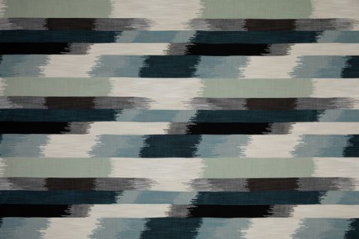 SOMBRE Perennials Performance Ikat Woven Fabric in a blue, green, white and black colours. Designed for outdoor upholstery and furniture.