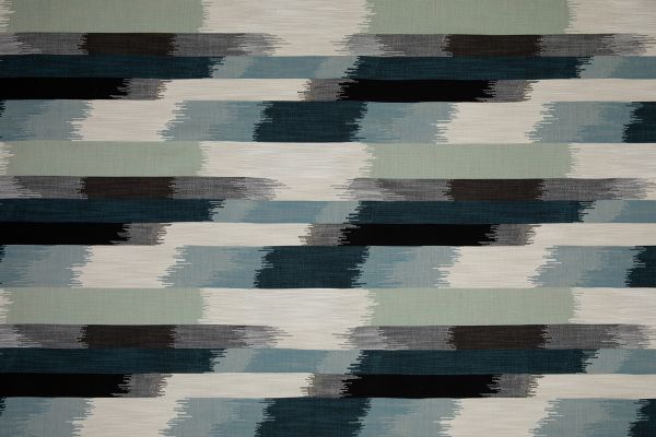 SOMBRE Perennials Performance Ikat Woven Fabric in a blue, green, white and black colours. Designed for outdoor upholstery and furniture.