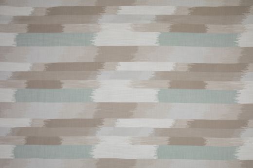 SOMBRE Perennials Performance Ikat Woven Fabric in a natural and pale blue colour. Designed for outdoor upholstery and furniture.
