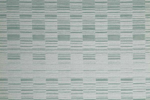 An outdoor, performance woven geometric stripe design in pale green tonal colours