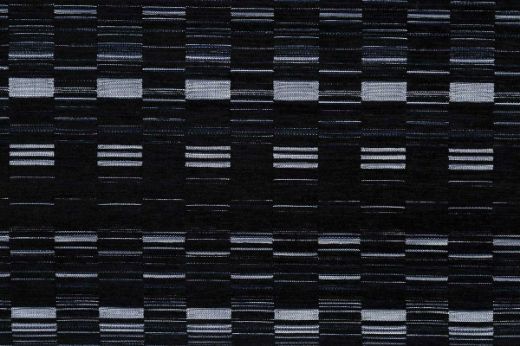 An outdoor, performance woven geometric stripe design in charcoal tonal colours with white accents