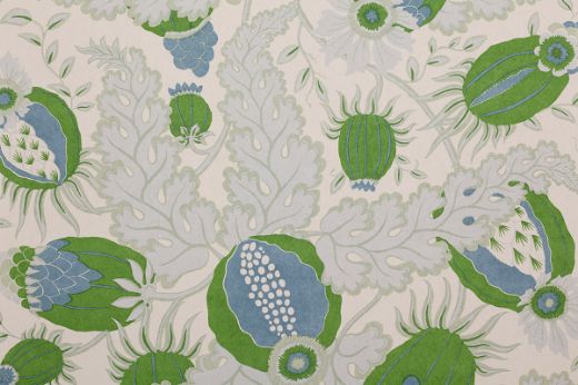 Christopher Farr Cloth Carnival Indoor Printed Wallpaper Grass. A detailed botanical illustration featuring large stylised flowers in shades of green and blue, with intricate leaves and stems on a light background.