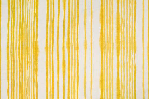 Yellow vertical stripes on a white base cloth with a hand painted look 