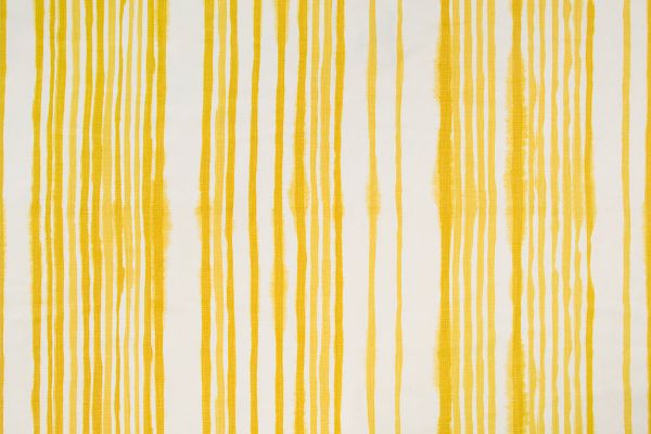 Yellow vertical stripes on a white base cloth with a hand painted look 