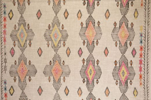 Geometric shapes in dark brown tones with pops of bright pinks, oranges and yellows.