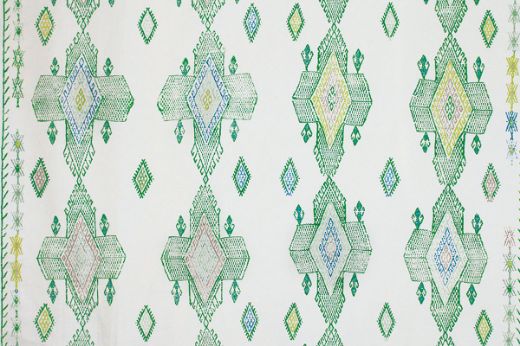 Geometric shapes in dark green tones with pops of blues and lime greens.