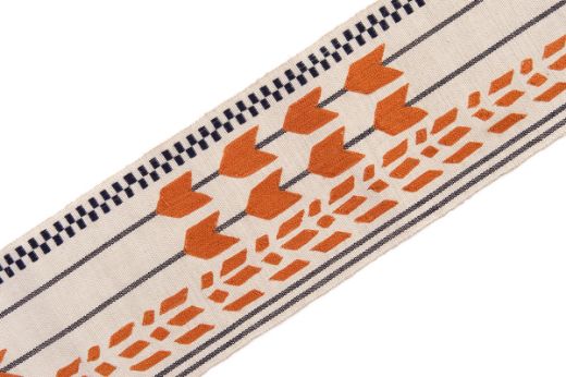 Geometric shapes in orange with charcoal stripes going vertically and check at one side.