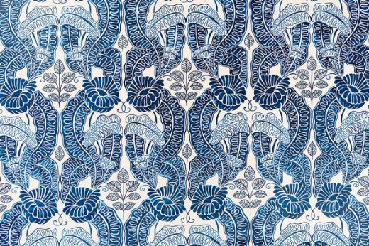 Belle-de-Nuit printed fabric in dark indigo blue shades over white linen, featuring a floral leaf design by Raoul Dufy for Christopher Farr Cloth. Printed in the UK