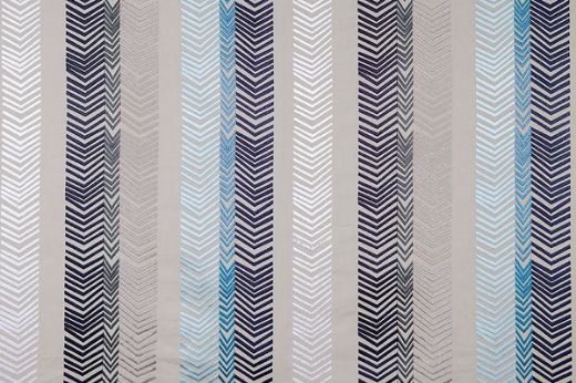 Bookend Embroidered Fabric by Kit Kemp on a natural linen base, featuring navy blue arrow embroidery in bold stripes, offering a sophisticated and textured design.