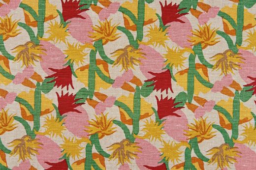 Repeated design of cactus flowers in the 'Ruby' colourway, part of the Cactus Flower collection by Commune for Christopher Farr Cloth, featuring vibrant pink, ruby red, green, and yellow hues.