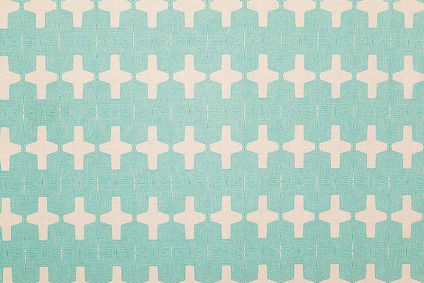 Laguna Printed Fabric in Turquoise – bold Aztec-inspired geometric pattern printed in vibrant turquoise on natural white linen.