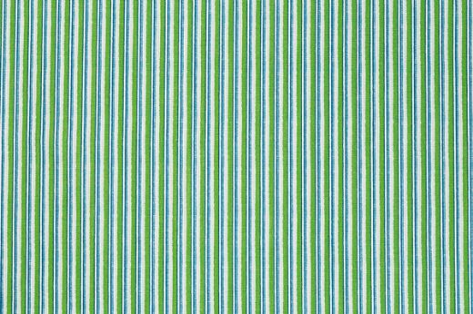 Detail of Peace and Love fabric in green and blue stripe pattern, printed on natural linen for a fresh, graphic look.