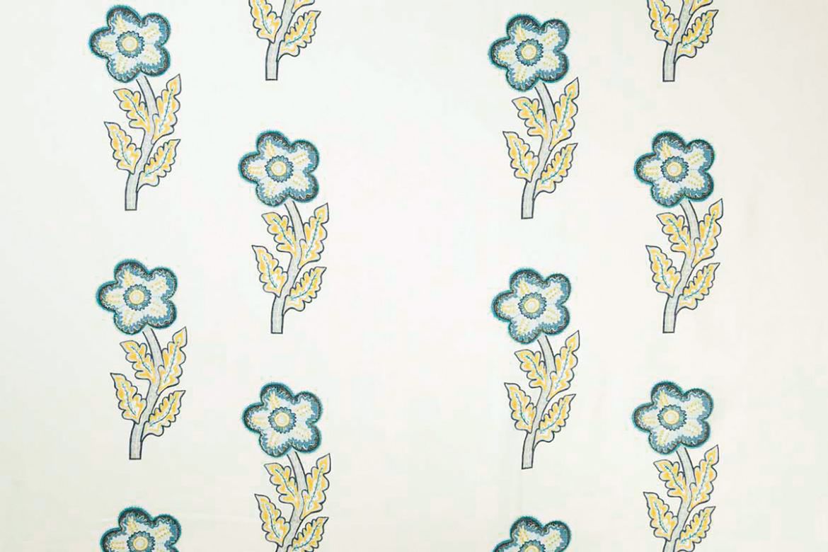 Large scale flowers in blues and yellows. Designed by Kit Kemp.