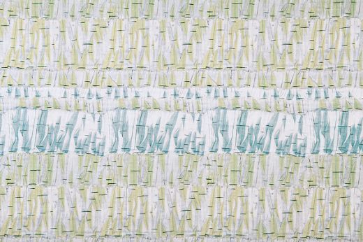 Abstract design in light blue and light-yellow colours with pops of indigo