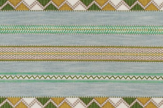Woven fabric in green and blue tone. Has zig zag motif stripes running horizonal.