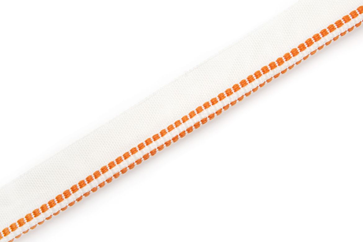 Hopscotch Performance Piping in Arancio, featuring a vibrant woven square design, ideal for adding a bold pop of colour and texture to outdoor and high-traffic upholstery projects.