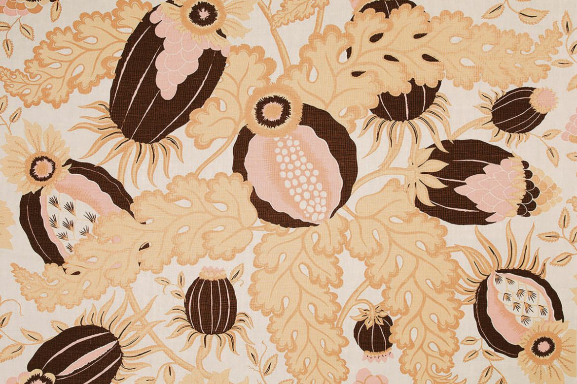 Carnival printed fabric in Copper colour, gold yellows and dark maroons. 