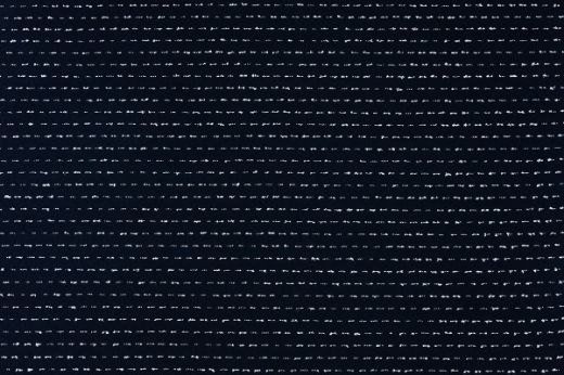 Woven textured fabric in dark indigo with white speckled stripes going horizontal 