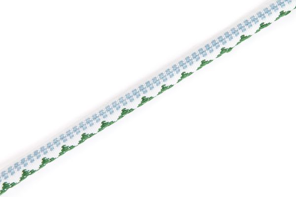 Verde: Pyramid Performance Piping in green and pale blue with embroidered geometric detail on neutral ground.