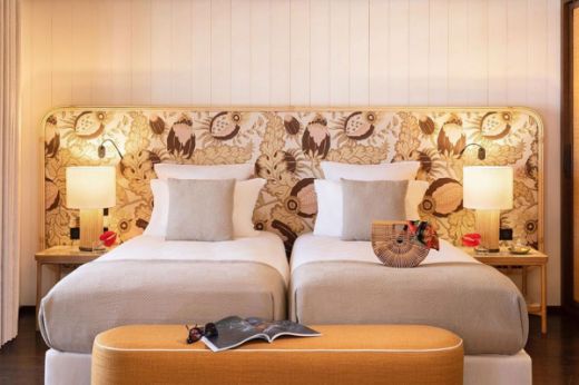 Image of a luxury hotel room with Carnival Copper as the bedhead. Location at Hotel Barriere Carl Gustaf