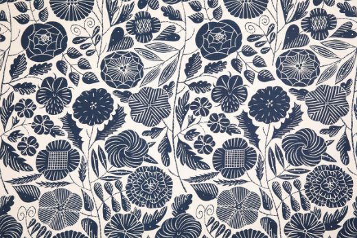 Eden Printed Fabric in Dark Indigo, showcasing vibrant hand-drawn florals in rich indigo tones against a natural linen background, creating a bold, elegant look for any interior.