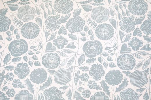 Eden Printed Fabric in Pale Blue, showcasing dainty hand-drawn florals in soft blue tones on a natural linen background, adding a light, airy touch to any room.