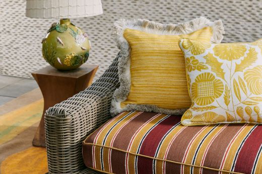 Eden cushion in lemon next to Hippie cushion in Lemon on todo Terricotta sofa 