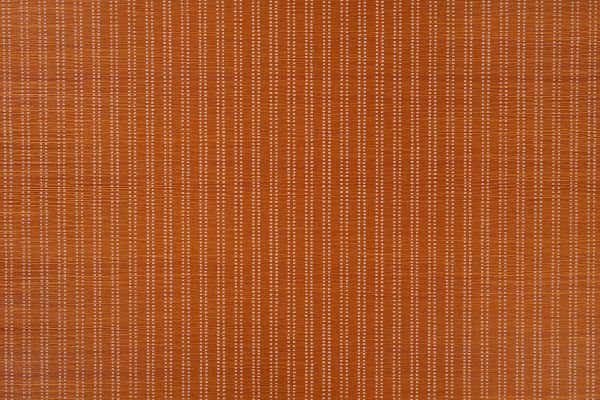 Algonquin grass cloth in dark orange colour, has ticking stripe in vertical lines in white 