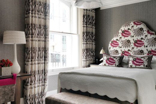 Design by Kit Kemp, Location at Haymarket Hotel London. Shows a bedroom with Willow Chocolate as the curtains