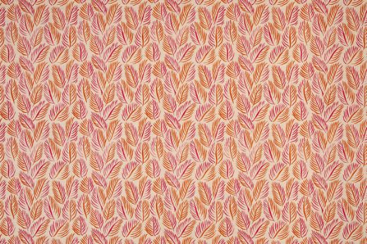 Armatures Feuilles luxury printed linen fabric featuring a vibrant hot pink and orange leaf design, showcasing the fine texture and bold, colourful pattern