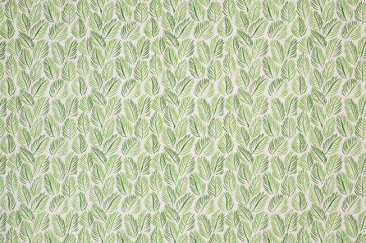 Armatures Feuilles luxury printed linen fabric featuring a vibrant mix of green hues and white leaf design, showcasing the fine texture and bold, colourful pattern