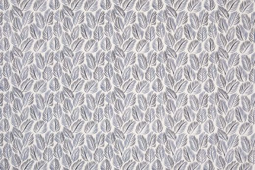 Armatures Feuilles luxury printed linen fabric featuring a vibrant indigo and white leaf design, showcasing the fine texture and bold, colourful pattern