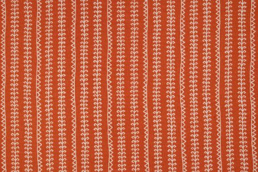 Woven fabric in vibrant orange with geometric patterned stripes going vertical 
