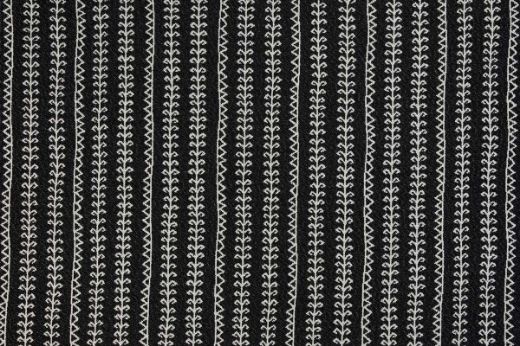 Woven fabric charcoal with geometric patterned stripes going vertical 