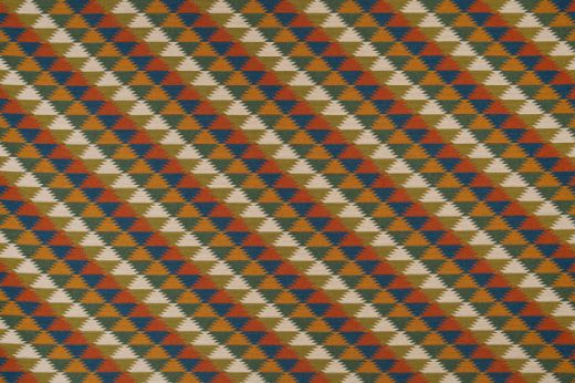 Woven fabric in blue, green, yellow and orange colours in a geometric pattern  