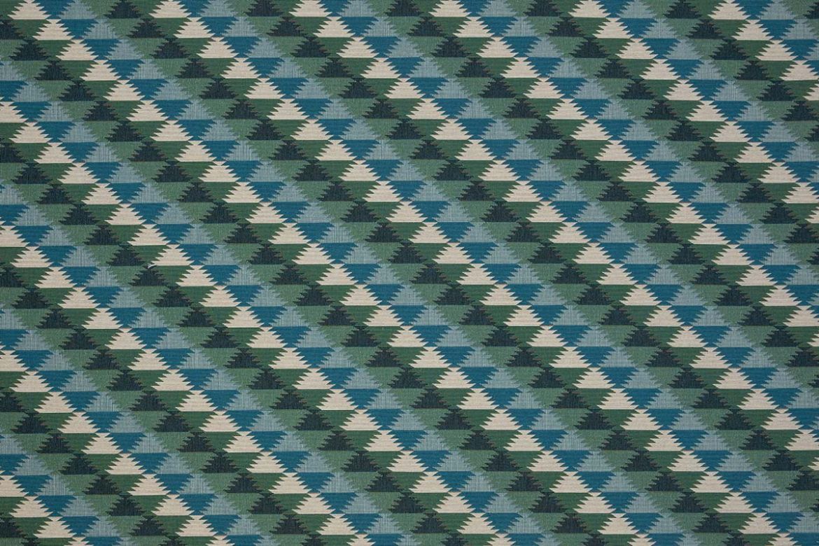 Woven fabric in blues and greens colours in a geometric pattern.  