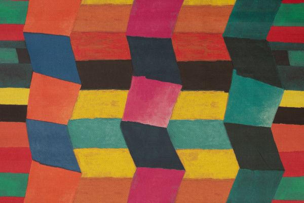 Bright colourful geometric blocks fit together to create a zig zag pattern in pinks, yellow, greens and blues