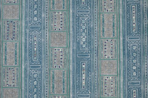 A vibrant wallpaper with vertical stripes and geometric patterns featuring diamonds, florals, and intricate borders in tones of blues and indigos