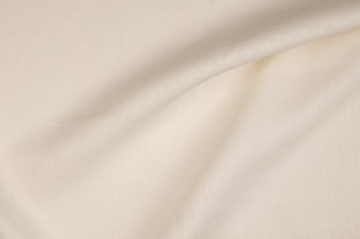 Close-up of Bruges fabric in ecru, white with delicate drape and natural texture.