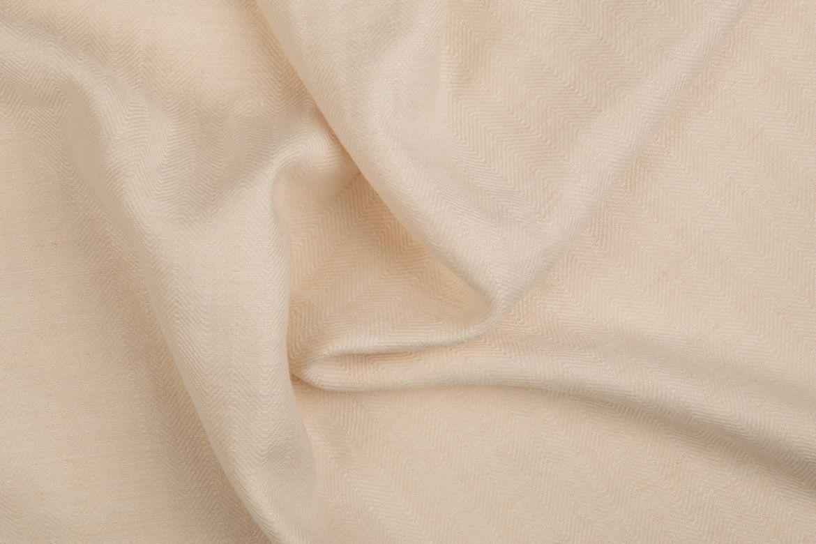 Soft beige Beaumont fabric with gentle folds and visible texture.