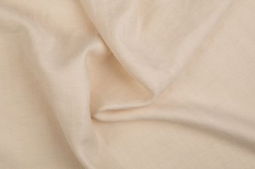 Soft beige Beaumont fabric with gentle folds and visible texture.